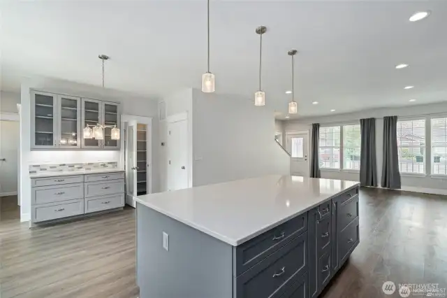 Dining area, kitchen, and living room.