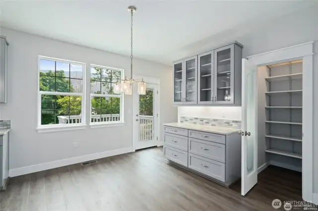 Dining area with coffee bar and walk-in pantry.