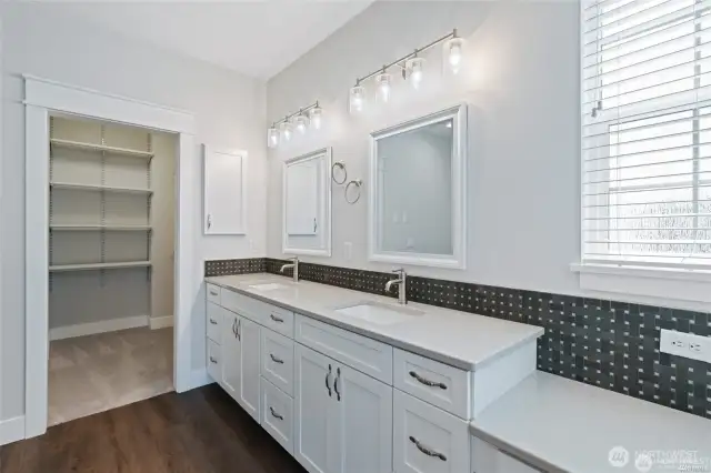 Quartz countertop in primary bathroom.