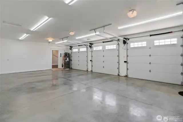 Large 3-car attached garage that is insulated, drywalled, and painted.