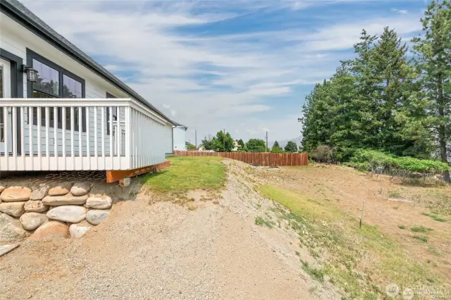 Back yard has 2 levels. More space below to plant additional grass, garden beds or possibly a pool?