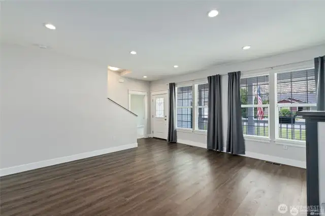 Living room with a wall of windows to let in all the natural light.