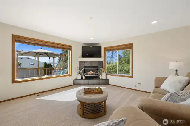 Large living room w/cozy propane fire place over looking the backyard and BRAND NEW DECK. Also wired for surround sound!