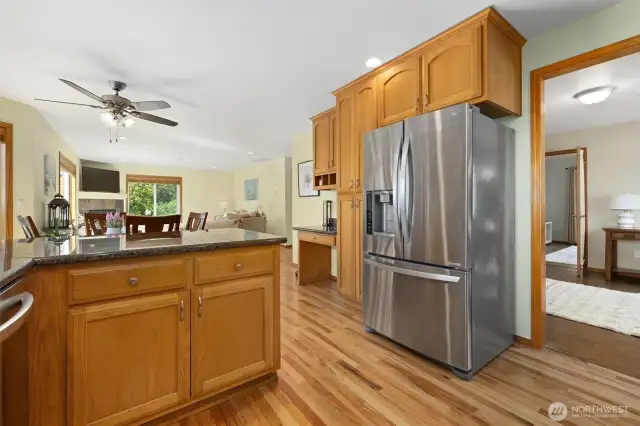 Kitchen view overlooking living room, dining room & to the right of the photo is a HUGE BONUS room.