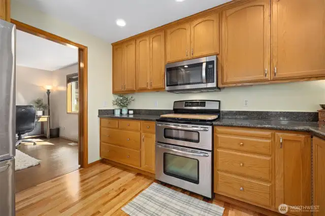 So much counter space & storage that you may never use it all. The doorway next to the fridge is the downstairs extra bonus room that is currently being used as an office.