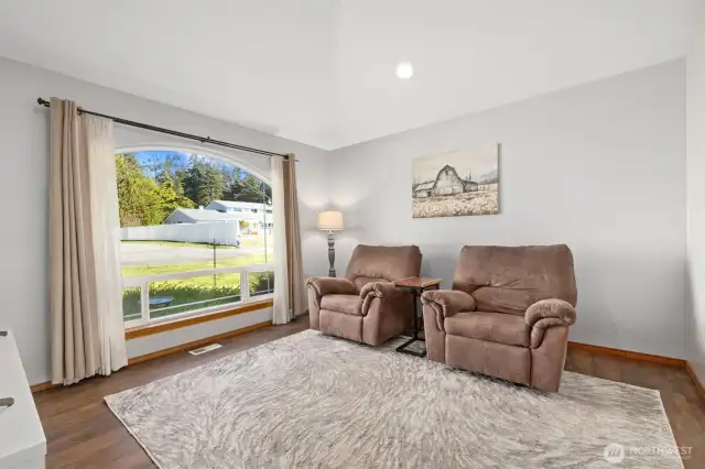 Front sitting/living room near front door. Connects to entryway of house & bonus room next to kitchen.