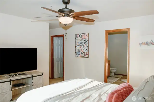 Primary bedroom looking towards your custom walk-in closet & 5 piece ensuite bathroom w/double vanity & jetted bathtub.