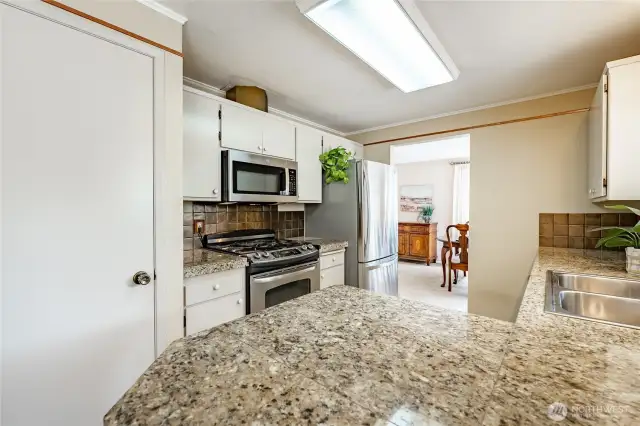 Kitchen with pantry and SS appliances
