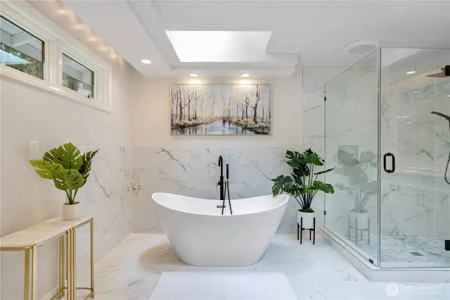 Luxurious, modern, and spacious bathroom designed with a serene and spa-like ambiance