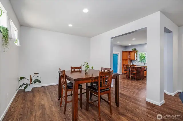Open concept dining area, with a view of the kitchen.