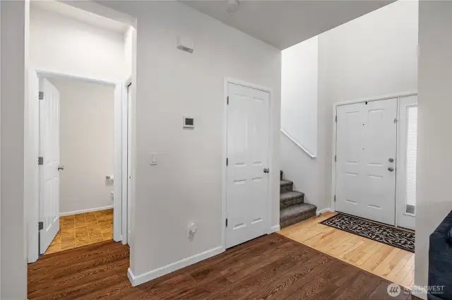 View of convenient 1/2 bath and stairs in living area.