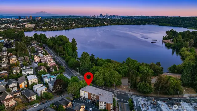 Top floor corner unit in small boutique building just across From Green Lake .  Near Zeeks, Dukes and above the Urban Bakery!  Easy commute to 99, I-5 and even the light rail!