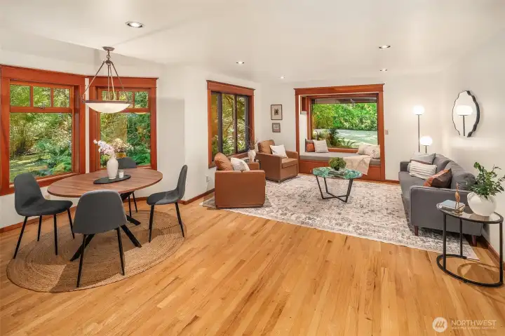 Great room with generous dining and living areas. Lots of room here for entertaining or cozying up in the window seat.