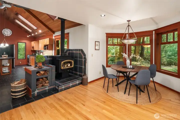 Dining area with wood stove for embracing warmth in the winter.