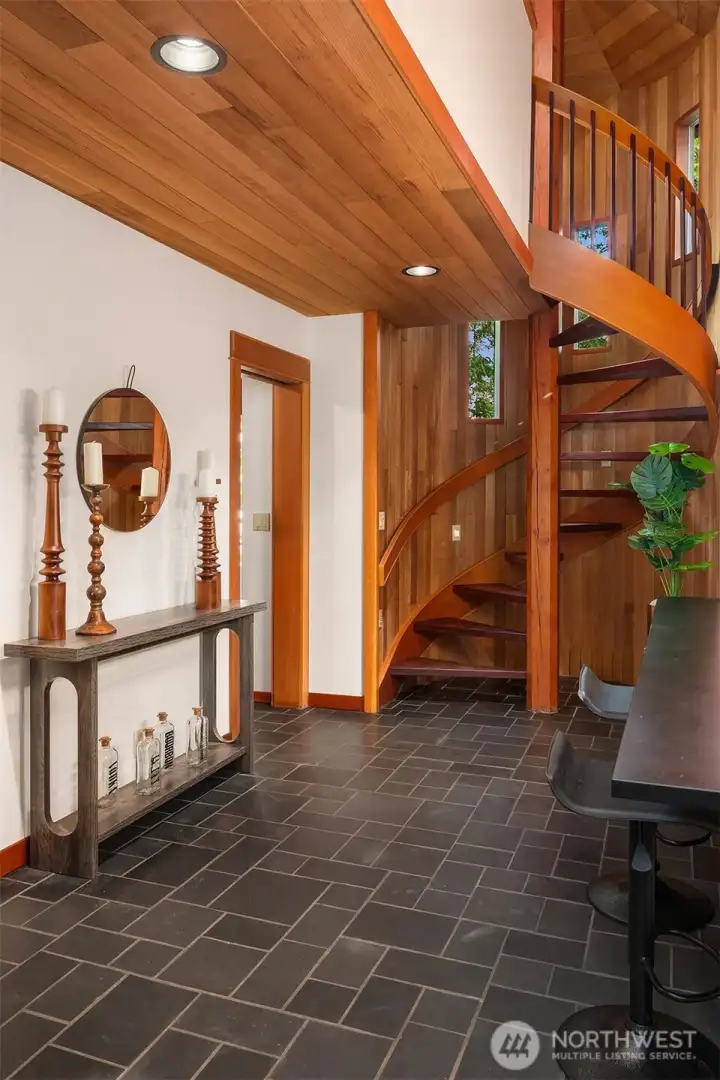 Spiral stair leads up out of kitchen area to the big loft workroom.