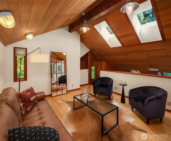 Loft above kitchen connects to second floor bedroom area too-- a perch from which to work or play!