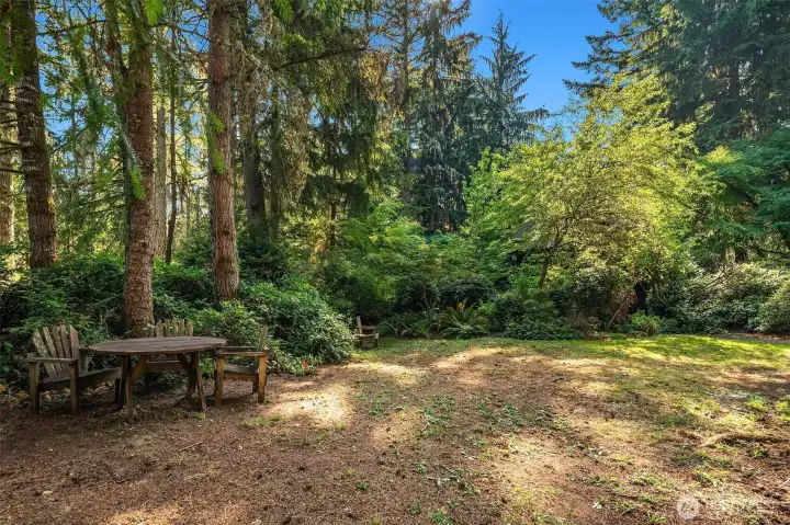 Another outdoor room awaits on the east side of the home. This landscape is truly magical!