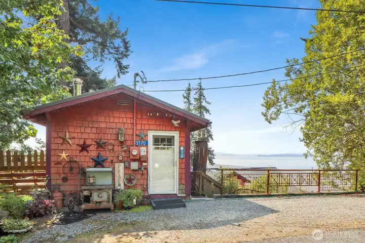 The 560 square foot "tiny home" provides living space or a job-shack while building a new residence