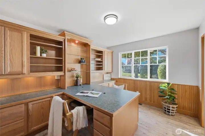Two additional bedrooms provide flexibility for guests, hobbies, or a home office — including one already outfitted with built-in cabinetry.