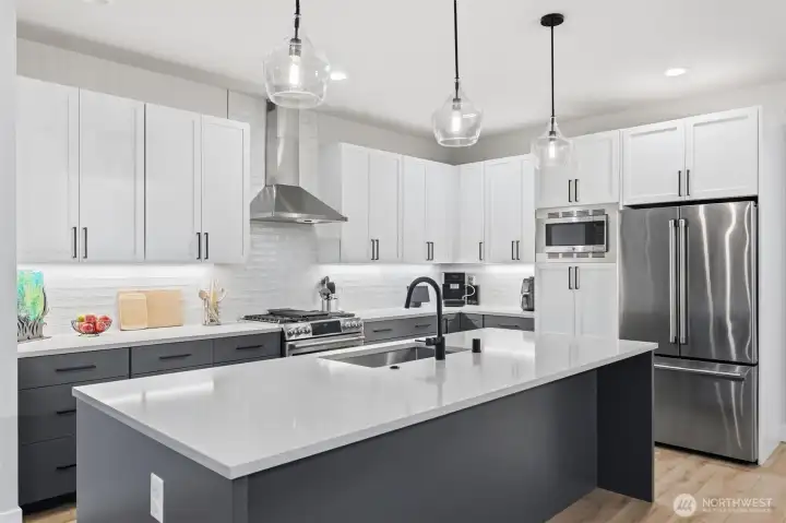 Pull up a stool or chair to the island for casual easy dining and entertaining. There is pantry space above and below the microwave.