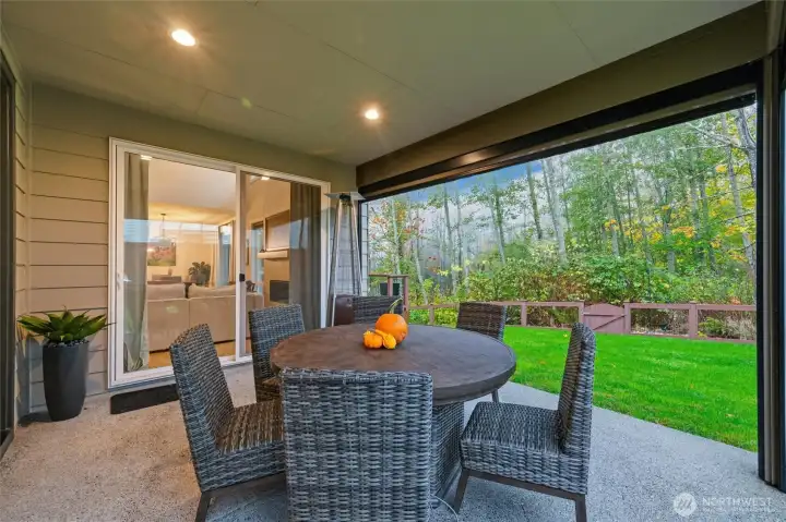 Savor year-round outdoor living. The Sunsetter shades retract for privacy and have a wind sensor.