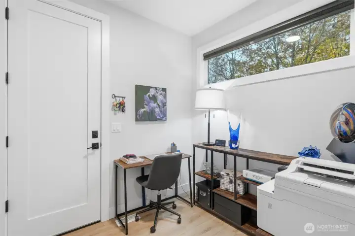 This "mud room" is being used as a home office; the door leads to the garage.