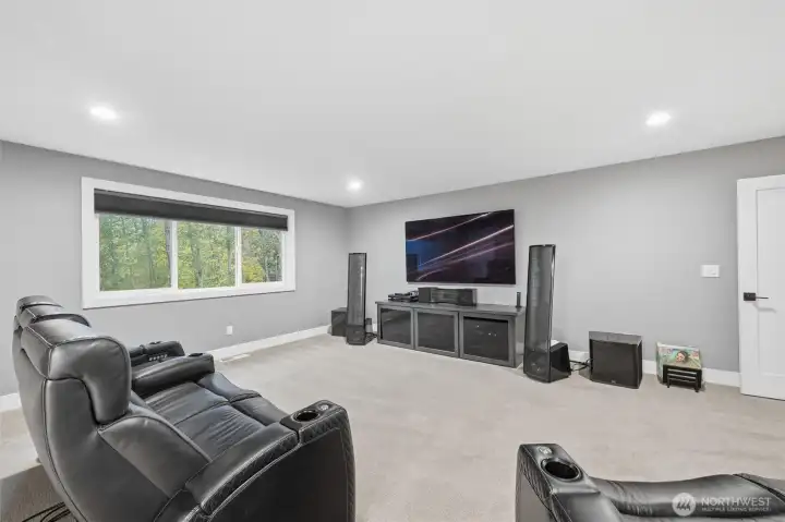 The theatre has a Dolby Atmos speaker system - 4 are in the wall and 4 are in the ceiling offering a seamless look.