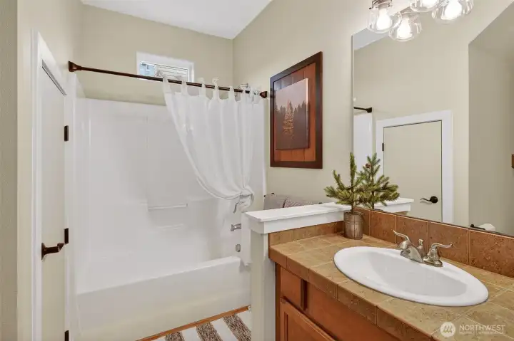 Full Bathroom located on main level off kitchen & living area