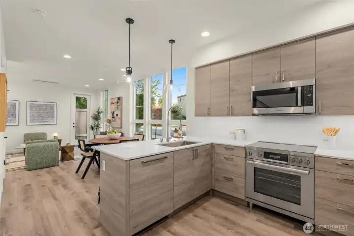 Open-concept living at its best. Entertain easily or wind down in peace—all surrounded by warmth, light, and intentional flow from kitchen to living to dining.
