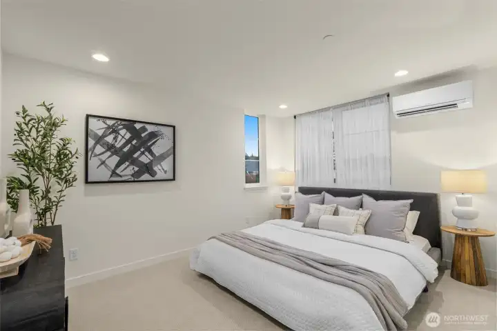 Your dreamy retreat awaits. The luxe primary suite offers a serene feel and natural light from every angle.