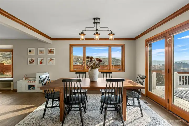 Dining with french doors to deck, patio private view yards.