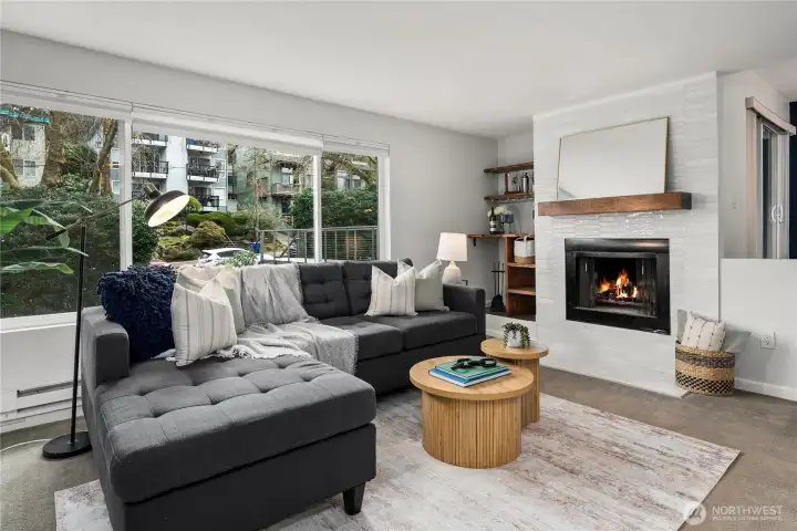 Sunken living room with wood burning fireplace and bar