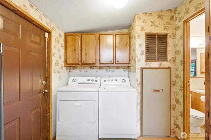 Dedicated utility room with added storage for everyday convenience and organization