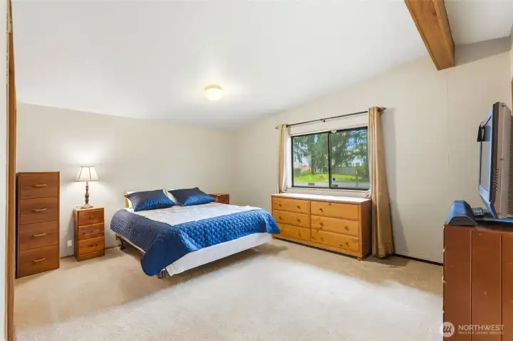 Oversized primary bedroom providing a peaceful retreat, complete with a private ensuite bath