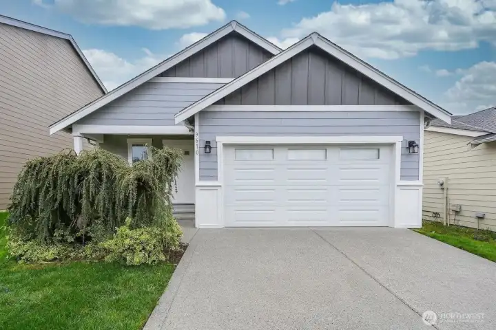 Single-level home in Graham with driveway and garage parking