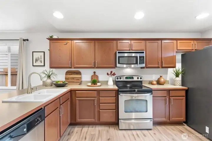 Kitchen with ample cabinetry and counter space ( Virtually Staged )