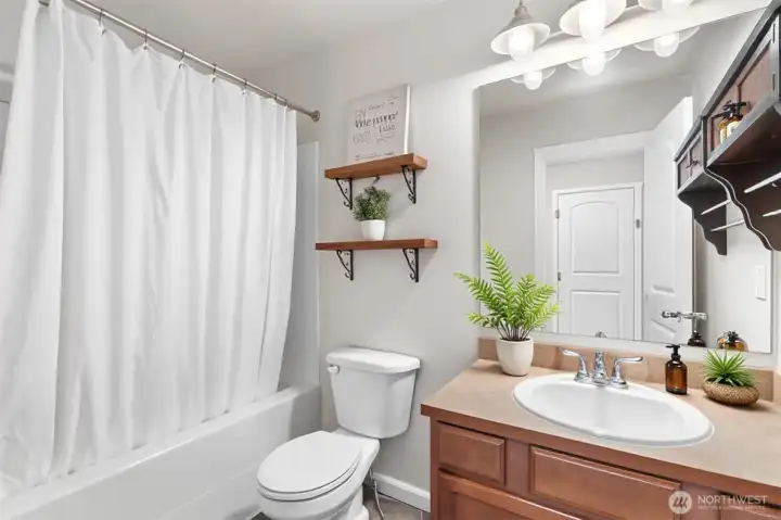 Full bathroom serving secondary bedrooms ( Virtually Staged )