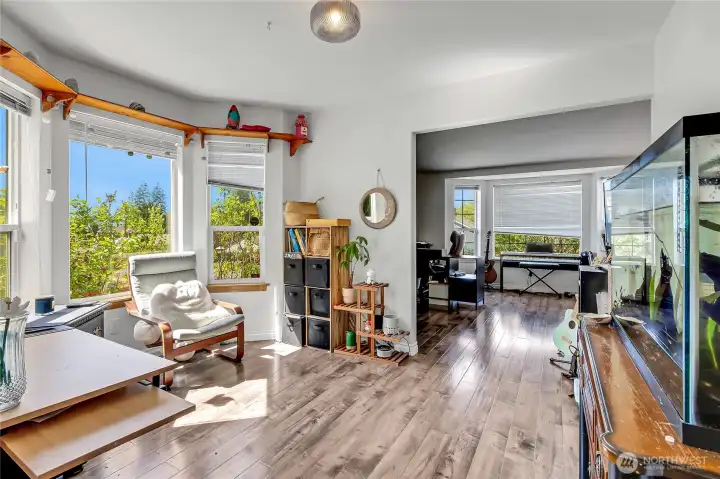 Flex room suitable for office or dining use with bay-style window.