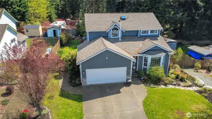 Front exterior with 2-car attached garage, masonry accents, and covered entry. Front exterior with 2-car attached garage, masonry accents, and covered entry.