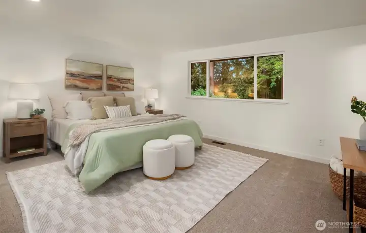 Primary windows overlook the backyard and peaceful forest.