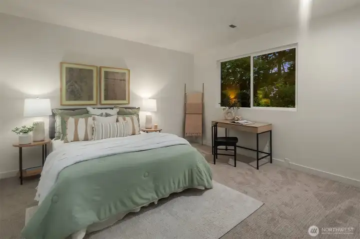 Lower bedroom (4th), looks out over lower deck and is large enough to serve as both guest bedroom and home office.