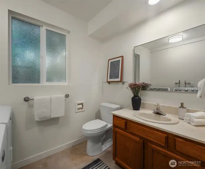 Lower 3/4 bathroom with laundry