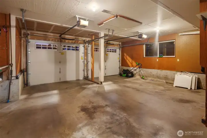 Two door garage easy fits two cars with additional space for work bench (not pictured) and a whole wall of floor to ceiling storage shelves (not pictured)