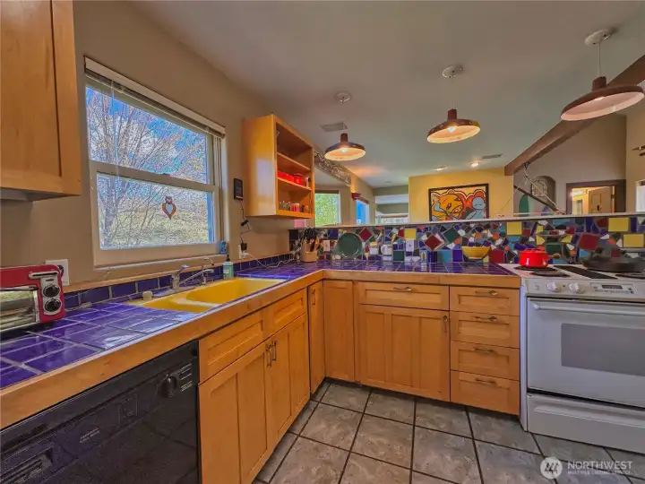 Open-concept kitchen flows seamlessly into the dining and living areas—ideal for gathering and entertaining