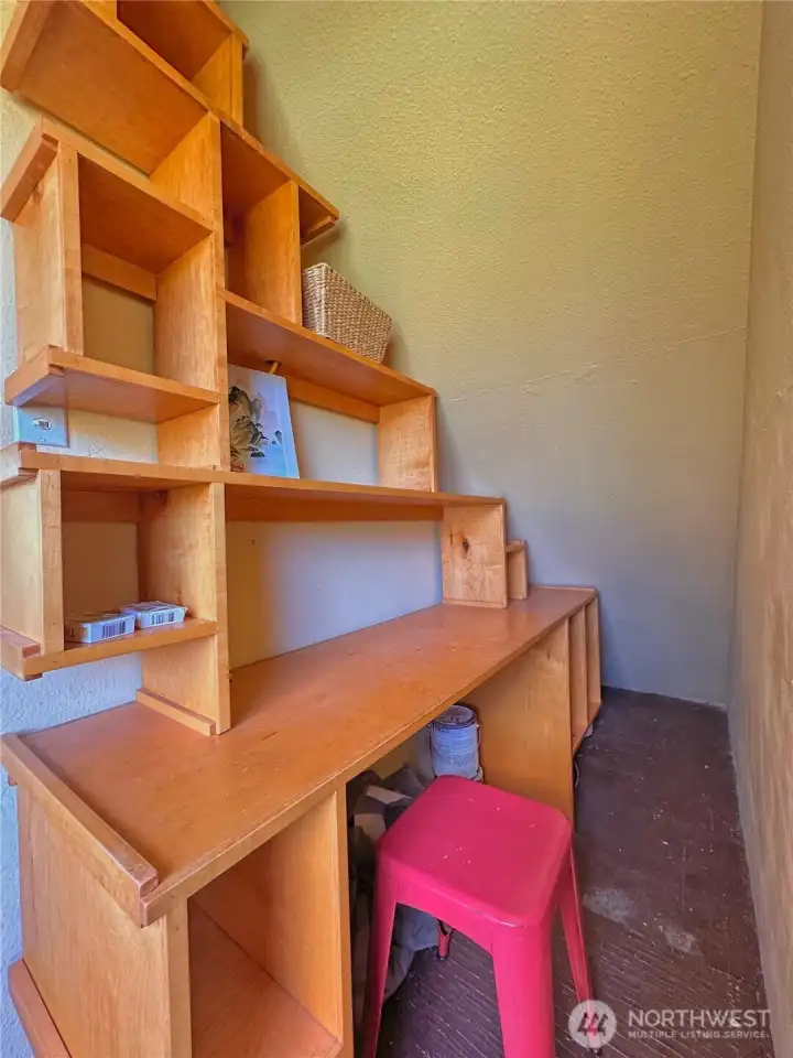 Thoughtfully designed office nook tucked under the stairwell, offering a convenient and efficient workspace