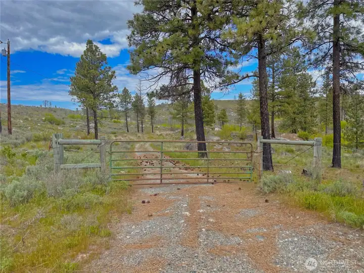 A gated entry and fully fenced acreage create a secluded, off grid feel while still offering all the comforts of modern residential living