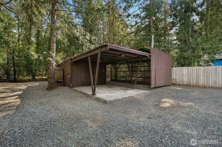 Covered space for parking and RV.