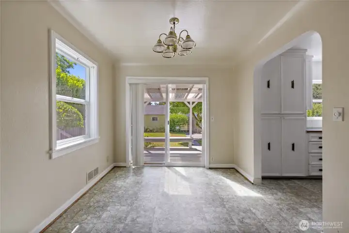 The dining room fits most larger tables and features a walk-out covered deck for 4 season enjoyment within the fully fenced yard. The dining room fits most larger tables and features a walk-out covered deck for 4 season enjoyment within the fully fenced yard.