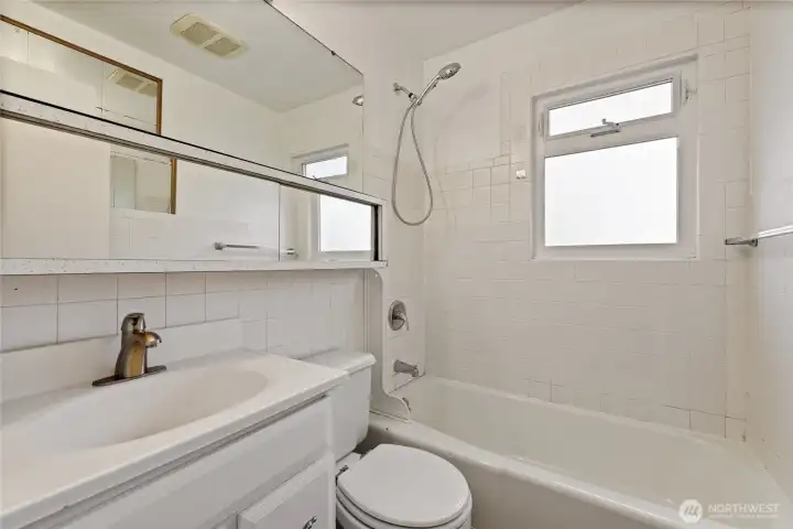 This full bathroom is located adjacent to the two main floor bedrooms. This full bathroom is located adjacent to the two main floor bedrooms.