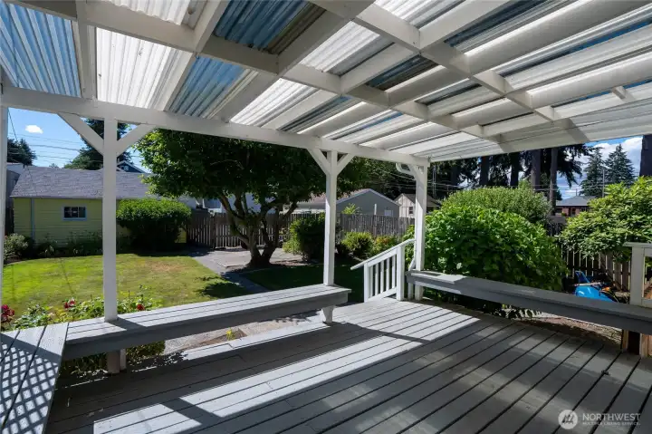 The covered rear porch is a wonderful four season space within the fully fenced and private yard. The covered rear porch is a wonderful four season space within the fully fenced and private yard.